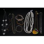 A collection of jJewellery. To include a pink freshwater pearl double strand bracelet, a three