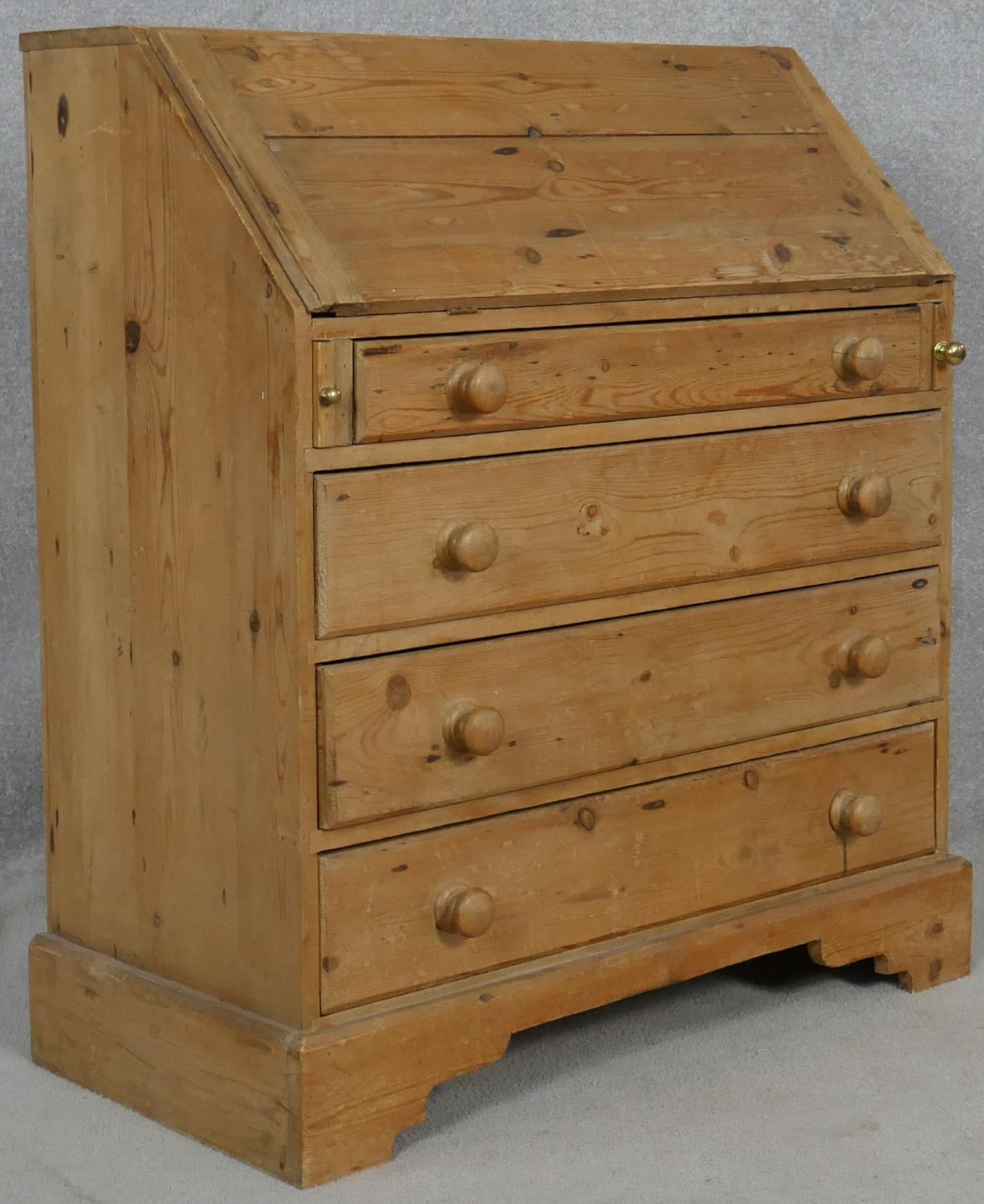 A 19th century pine bureau with fall front revealing a fitted interior above four long graduated - Image 4 of 4
