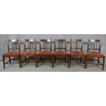 A set of six 19th century mahogany bar back dining chairs with reeded slats above drop in seats on