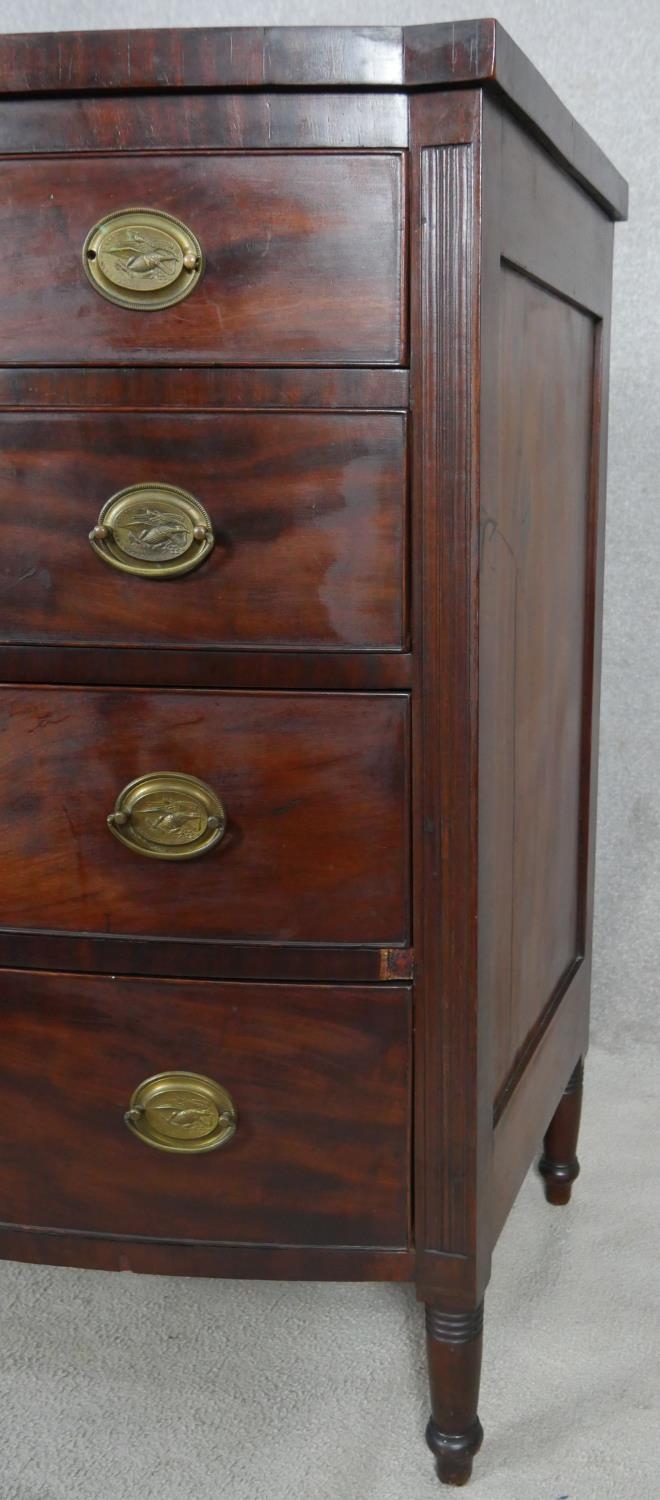A 19th century mahogany bowfronted chest of four long drawers flanked by reeded pilasters on - Image 4 of 10
