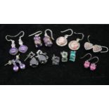 Ten pairs of gemset silver earrings with seven certificates. To include five pairs of drop