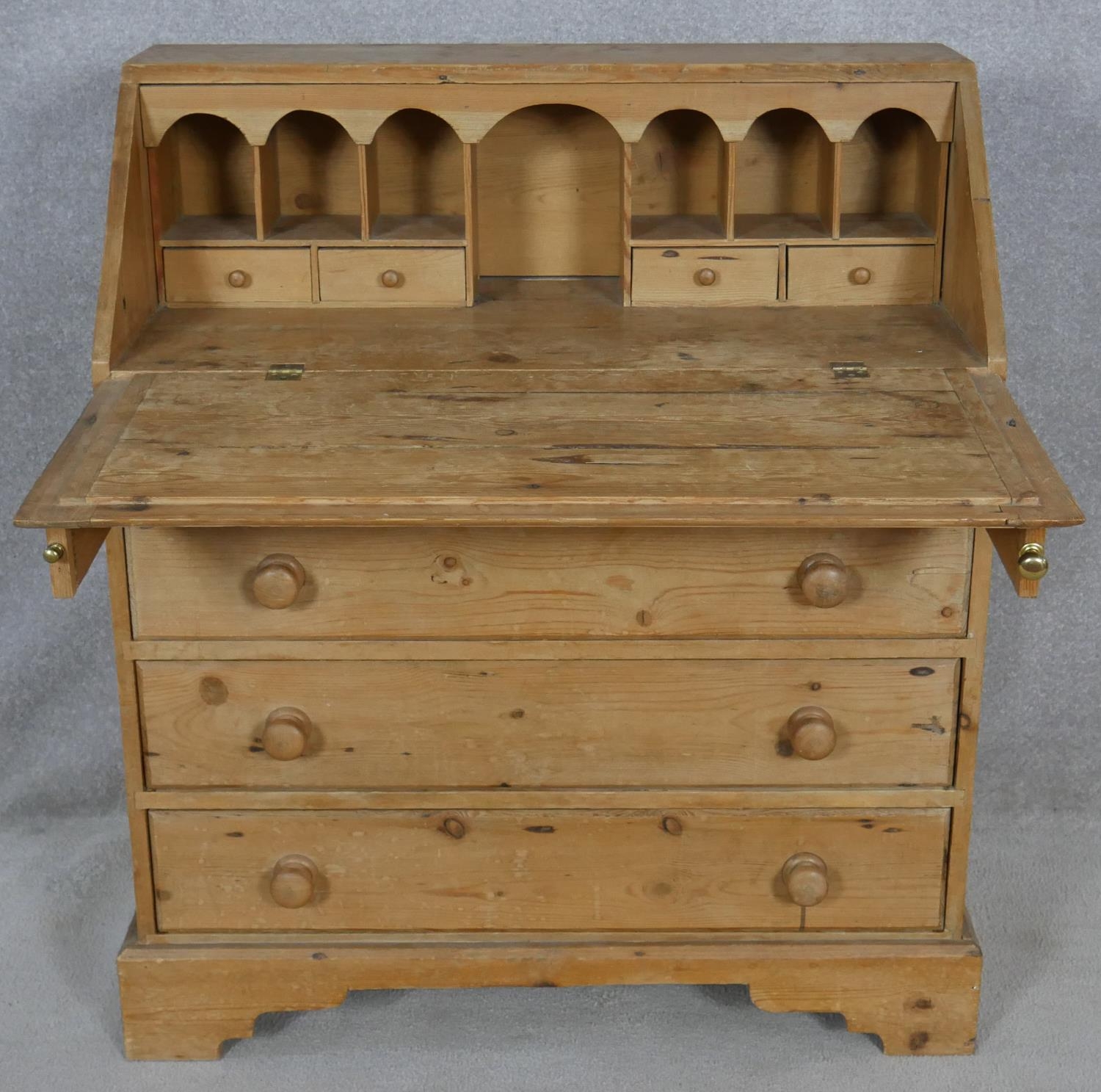 A 19th century pine bureau with fall front revealing a fitted interior above four long graduated - Image 3 of 4