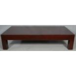 A large contemporary coffee table on block supports. H.41.5 L.182 W.92cm