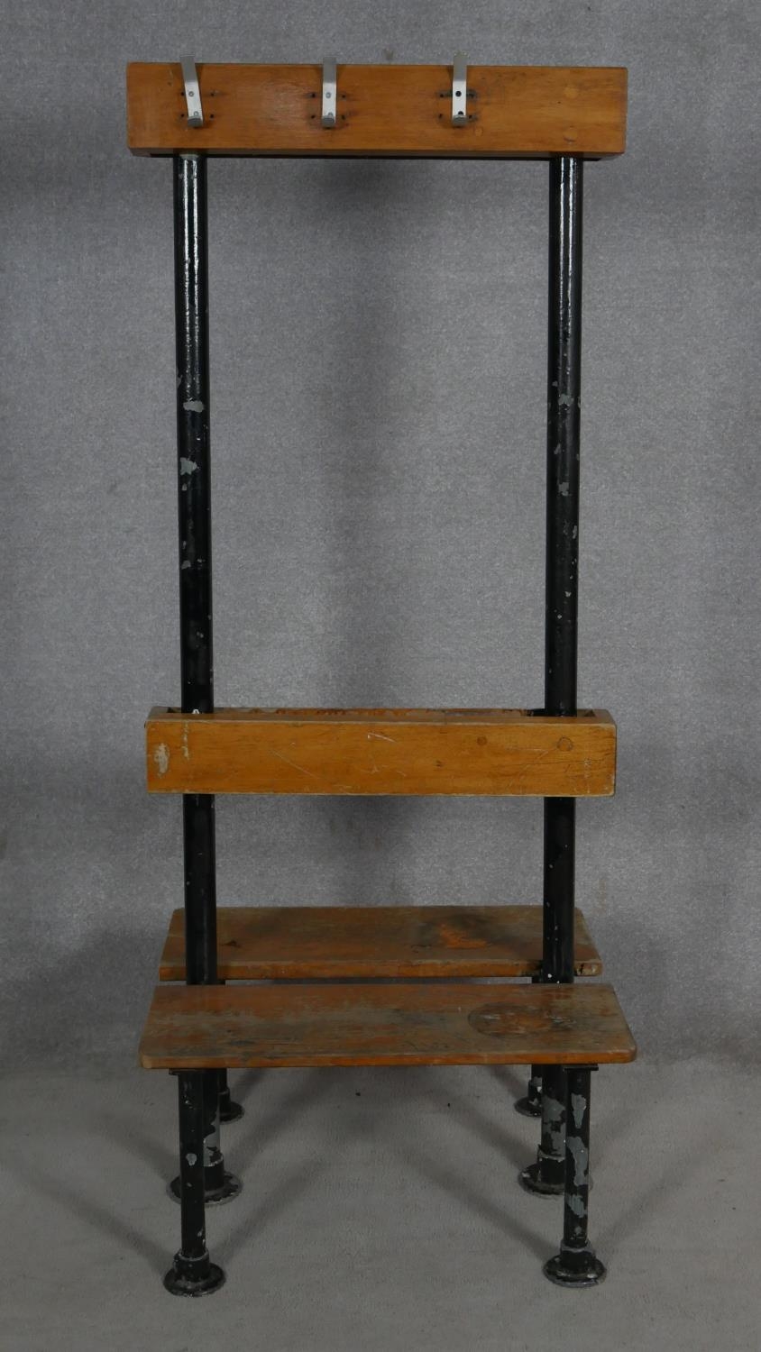 A mid century vintage teak and iron framed school or changing room bench and coat stand. H.171 L.