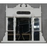 A late 19th century painted overmantel mirror with triple bevelled plates. H.87 W.101cm