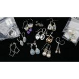 Twelve pairs of gemset silver earrings. Including a pair of topaz and amethyst butterfly drop