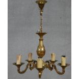 A six branch brass chandelier with scrolling foliate arms. D.40cm