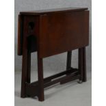 A late 19th century Art and Crafts walnut drop flap Sutherland table. H.57 L.69 W.64cm