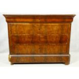 A 19th century French Louis Phillipe figured mahogany commode with marble top above four long