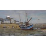 A framed and glazed watercolour, fishing village with boats, signed John Hewitt. H.36 W.52.5cm