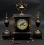 A late 19th century French slate and marble mantel clock with ormolu mounts, the ceramic face marked