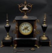 A late 19th century French slate and marble mantel clock with ormolu mounts, the ceramic face marked