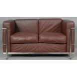 After Le Corbusier, an LC2 Cassina two seater sofa in piped leather upholstery on tubular chromium