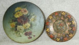 A large 19th century hand decorated oil on metal floral wall hanging display dish and an Eastern