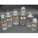 A miscellaneous collection of six 19th century apothecary's jars with stoppers, various labels, some