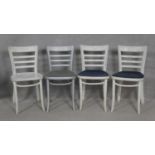 A set of four painted bentwood dining chairs. H.80cm (some damage as photographed).