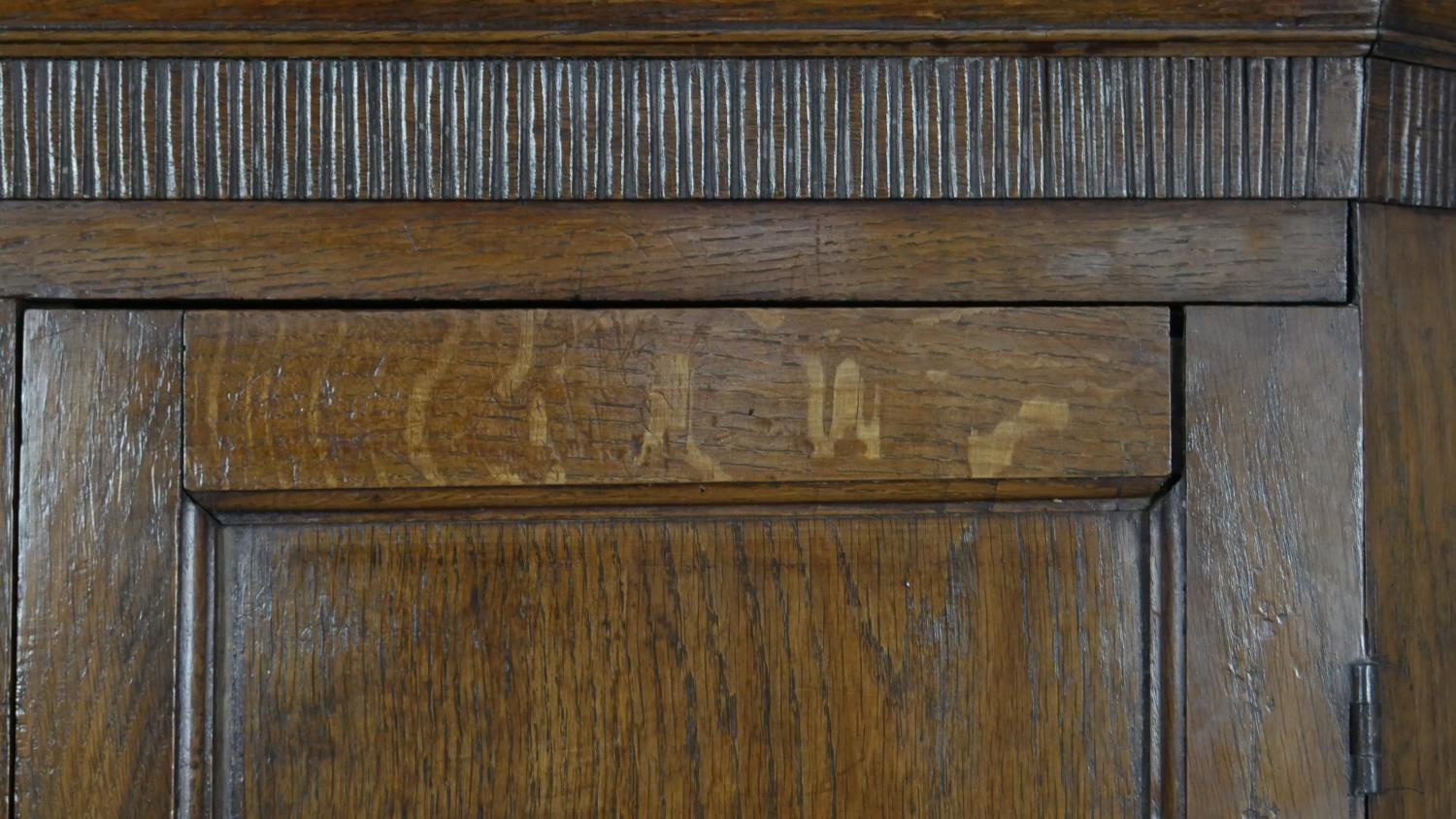 A Georgian oak two section corner cupboard with panel doors enclosing shelves on shaped bracket - Image 3 of 4