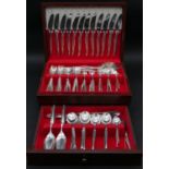 A canteen of silver plated Christofle cutlery, nine pieces for twelve settings along with serving