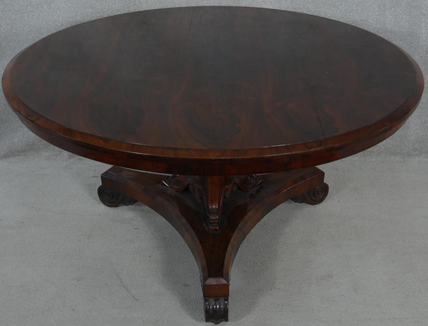 A Regency rosewood tilt top dining table on acanthus scroll carved pedestal and platform base. H. - Image 2 of 6