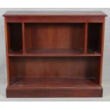 A contemporary mahogany open bookcase on plinth base. H.83 W.96.5 D.25cm