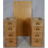 A pair of 19th century pine military style pedestals with inset brass handles along with a modern