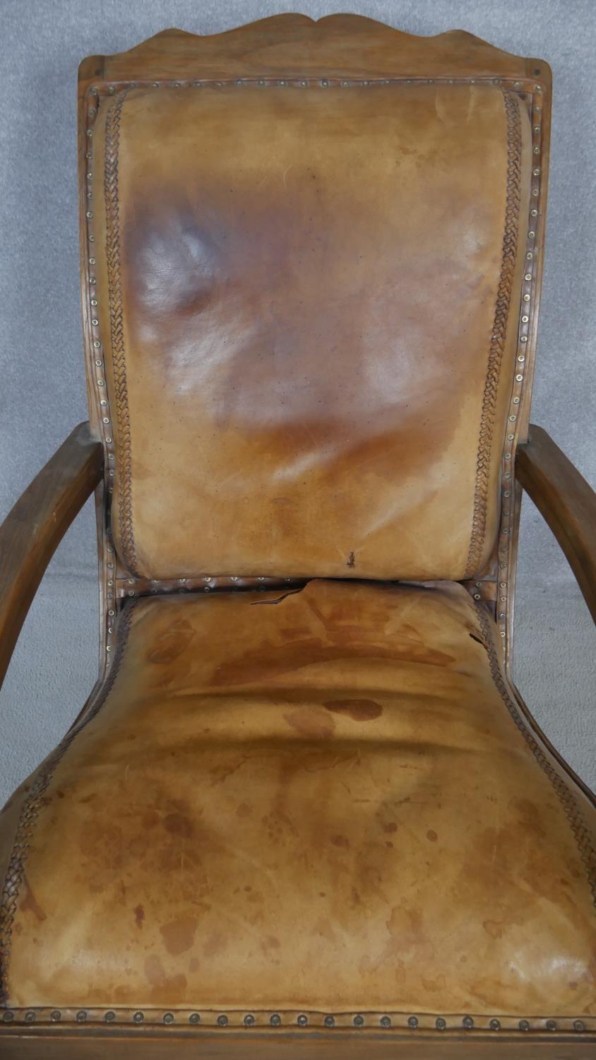 A 19th century teak planter's style armchair with folding leg rests in leather upholstery on - Image 6 of 8