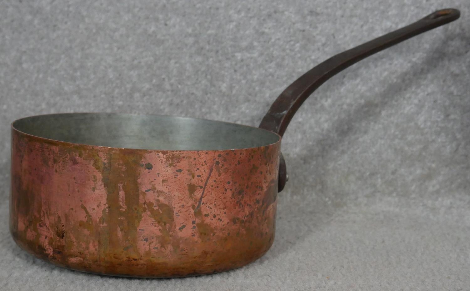 A brass and copper coal scuttle, a copper pan and teapot, a vintage coffee grinder and a 2lb weight. - Image 7 of 8