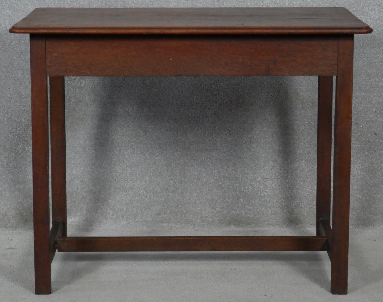 A late 19th century country oak side table with moulded top on square section stretchered