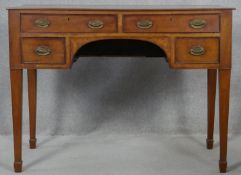 A 19th century mahogany writing table with original plate brass handles on square tapering