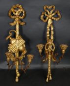 A late 19th century carved giltwood and gesso twin branch wall sconce with ribbon and swag