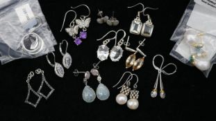 Twelve pairs of gemset silver earrings. Including a pair of topaz and amethyst butterfly drop