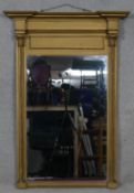 A 19th century gilt pier mirror, the plate flanked by Corinthian columns on plinth base. H.114 W.