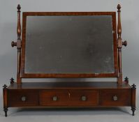 A Regency mahogany and satinwood strung toilet mirror with original plate and fitted base raised