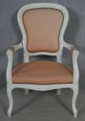 A white painted French style open armchair on cabriole supports. H.99.5cm
