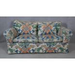 A two seater sofa in polychrome Chinese design upholstery. H.75 W.160 D.100cm