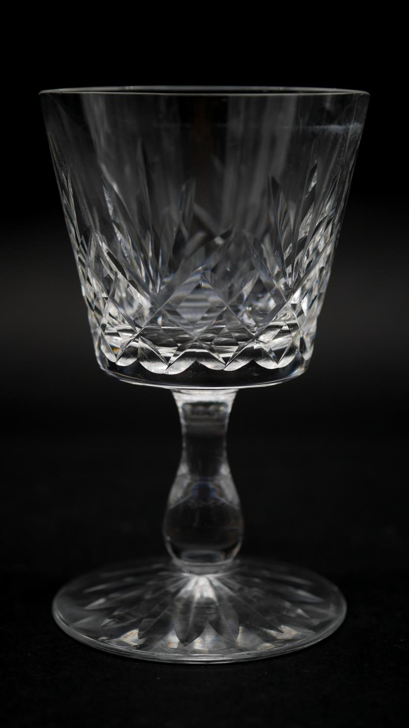A collection of twelve glass sherry glasses with stylised foliate design and star cut bases. H.13cm - Image 3 of 3