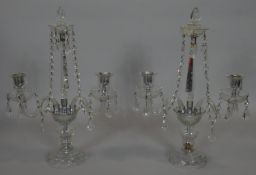 A pair of vintage twin branch table candelabras in glass and with cut crystal drops. H.49cm