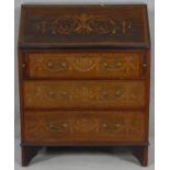 An Edwardian mahogany bureau with fitted interior and profuse all over ribbon and urn satinwood