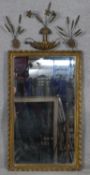 A 19th century carved giltwood wall mirror with gesso corn ear and floral cresting in gadrooned