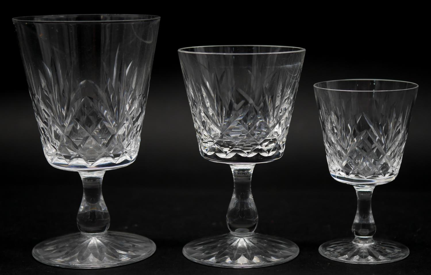 A collection of twelve glass sherry glasses with stylised foliate design and star cut bases. H.13cm - Image 2 of 3