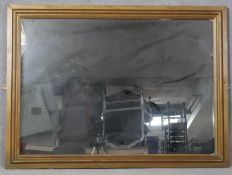 A rectangular wall mirror in painted moulded frame. H.84.5 W.114.5cm