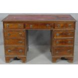 A 19th century mahogany three section pedestal desk with inset leather top resting on bracket