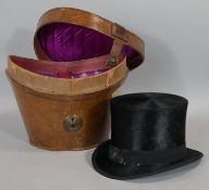 A vintage Christys top hat in fitted leather carrying case. H.28 L.35 W.33cm (Box)