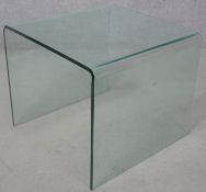 A contemporary curved glass designer occasional table. H.43 W.50 D.50cm