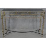 A contemporary gilt metal console table with fretwork frieze on stretchered supports. H.80 W.120 D.