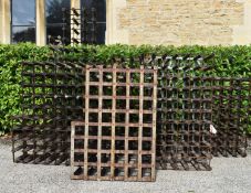 A collection of seven wine racks, various sizes. H.137 W.34 D.24cm (7)
