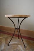 A wrought metal conservatory occasional table with faux stone mosaic top. H.54 Dia.40cm