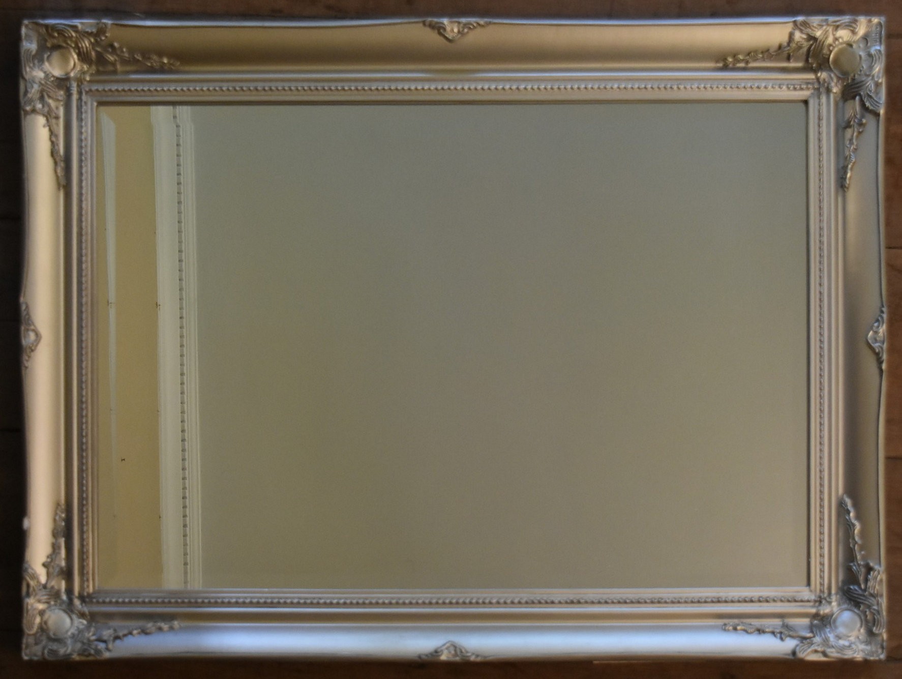 A white painted Rococo style wall mirror and a similar gilt example. H.90 W.64cm (largest) - Image 2 of 7