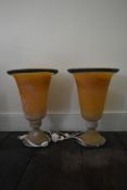 A pair of contemporary opaque amber and blue glass table uplighters. H.46cm