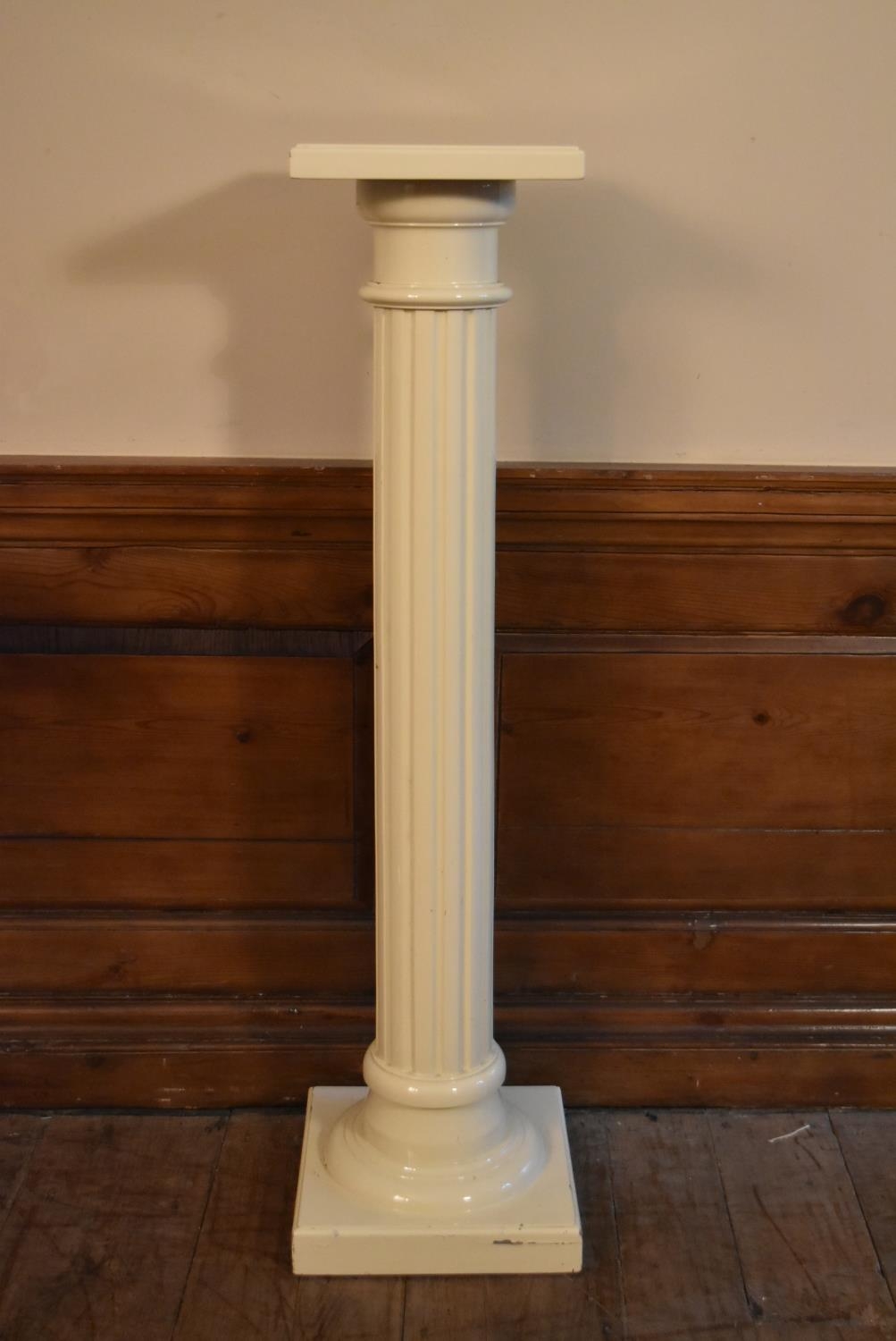 A vintage painted torchère with fluted column on stepped base. H.109 W.26cm